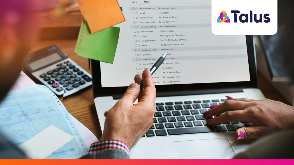 A professional reviews an overflowing email inbox on a laptop as part of an email first resourcing workflow.