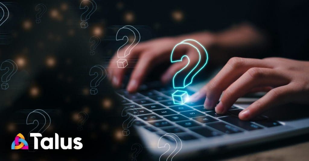 Hands typing on a laptop as a glowing neon question mark rises from the keyboard. Talus logo.